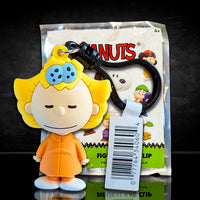Monogram Peanuts Series 4 Sally Brown figural bag clip in orange outfit with black carabiner clip packaging visible