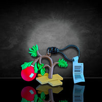 Monogram Charlie Brown Christmas Tree Peanuts Series 4 figural bag clip with keychain and tag against dark background