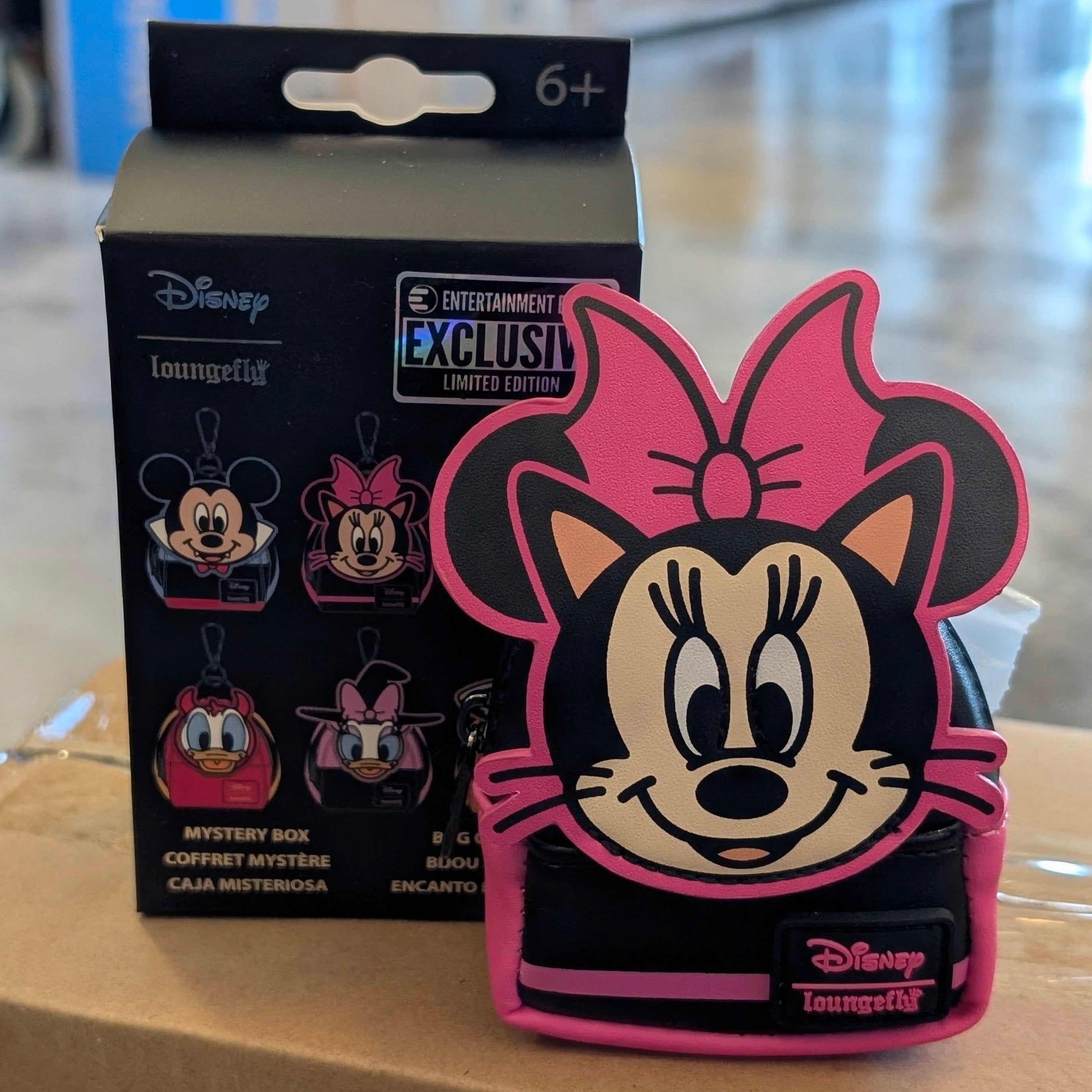 Loungefly Disney Minnie Mouse as Cat mini backpack bag charm with pink bow and black cat costume, 4 inches tall.