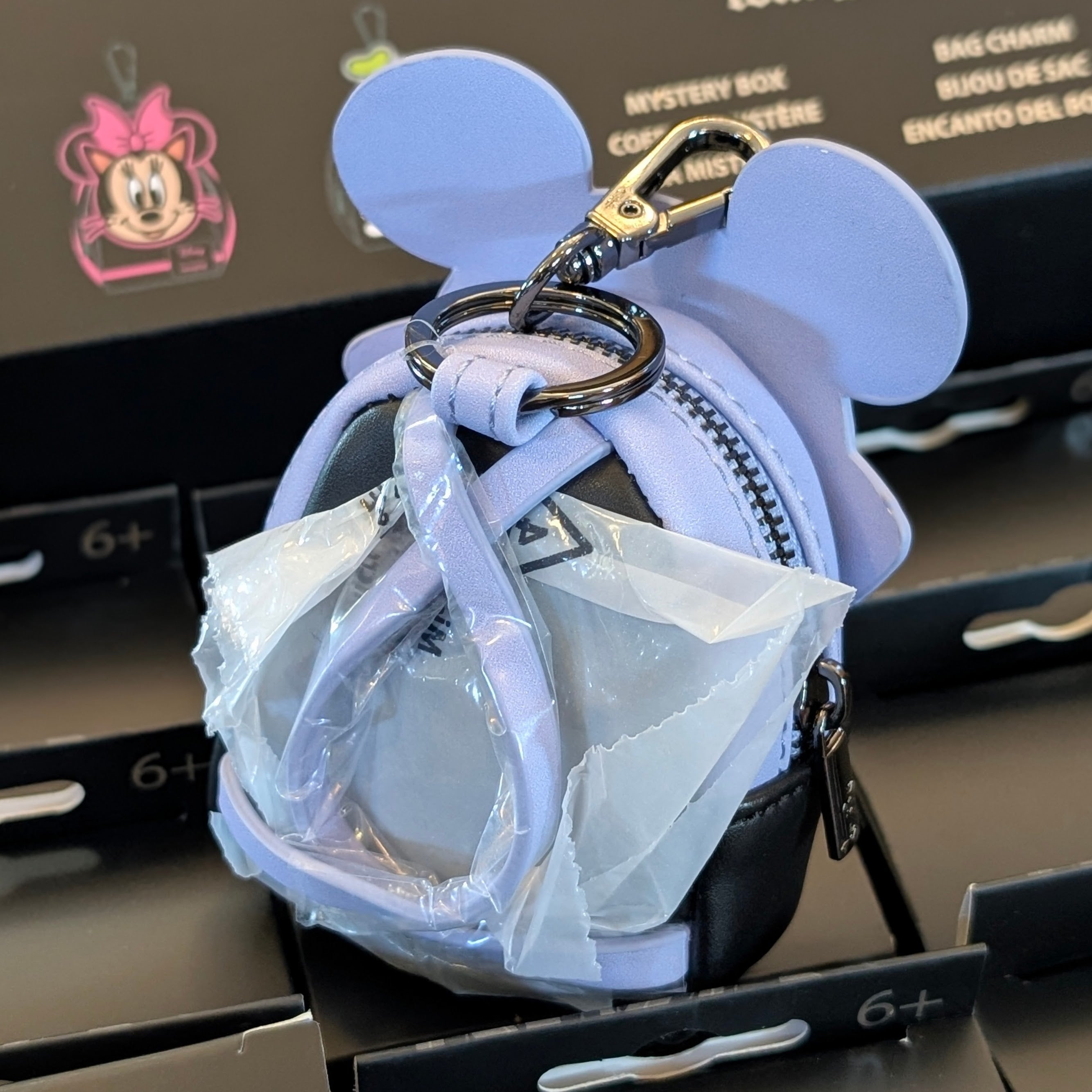 Loungefly mini backpack bag charm featuring Mickey Mouse ears in soft purple with keychain clip attached