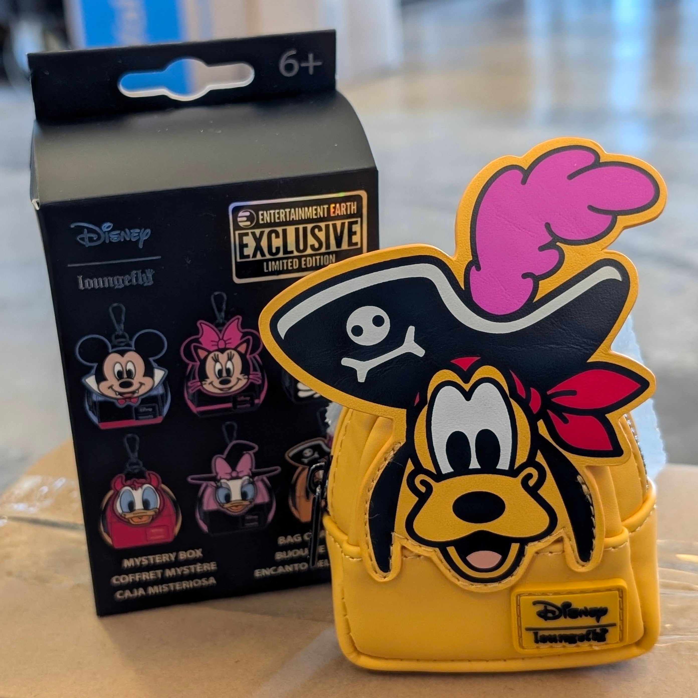 Disney Loungefly mini backpack bag charm featuring Pirate Pluto with a black hat and feather, exclusive Entertainment Earth design.