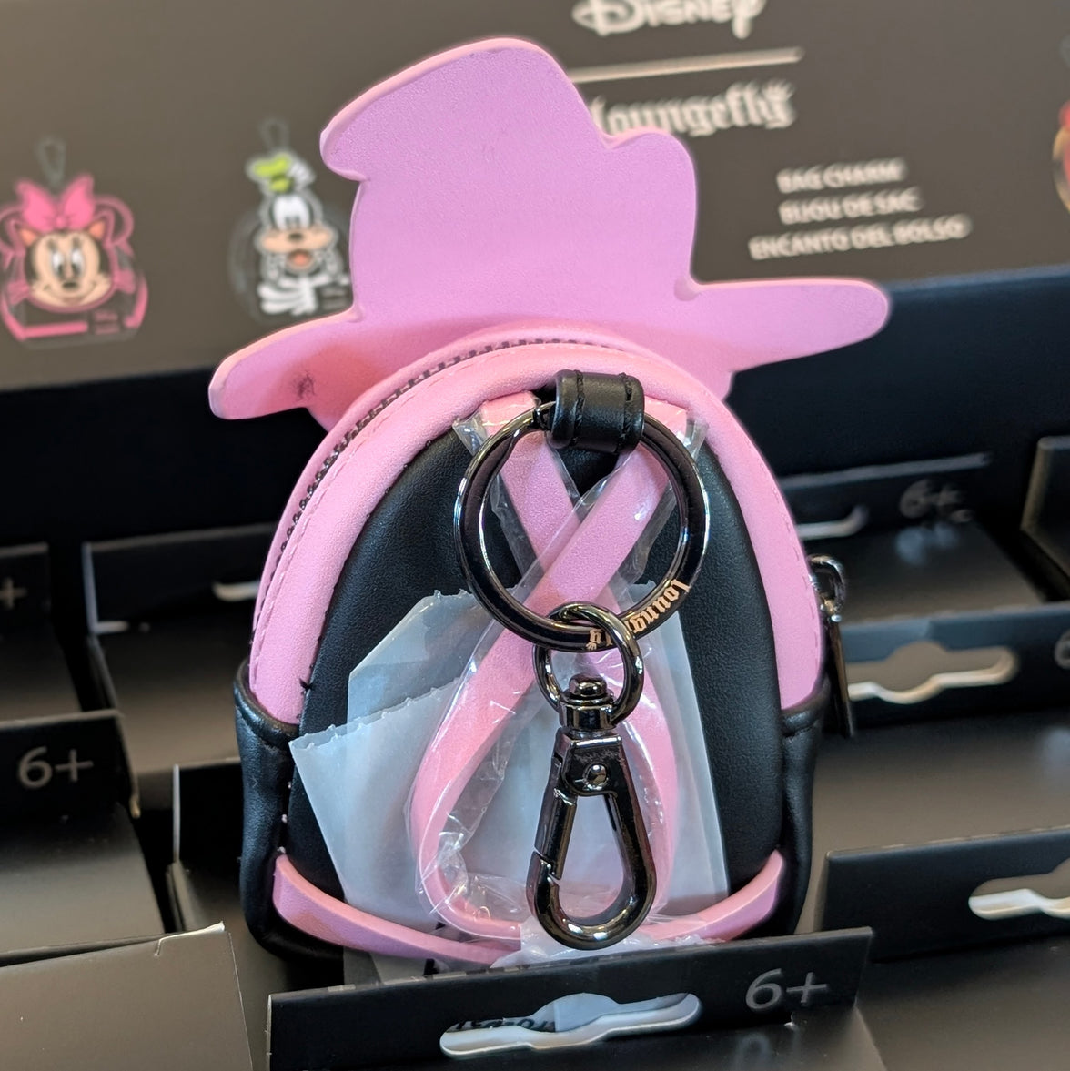 Loungefly Disney mini backpack bag charm featuring Witch Daisy Duck design with pink and black detailing and metal clip clasp.