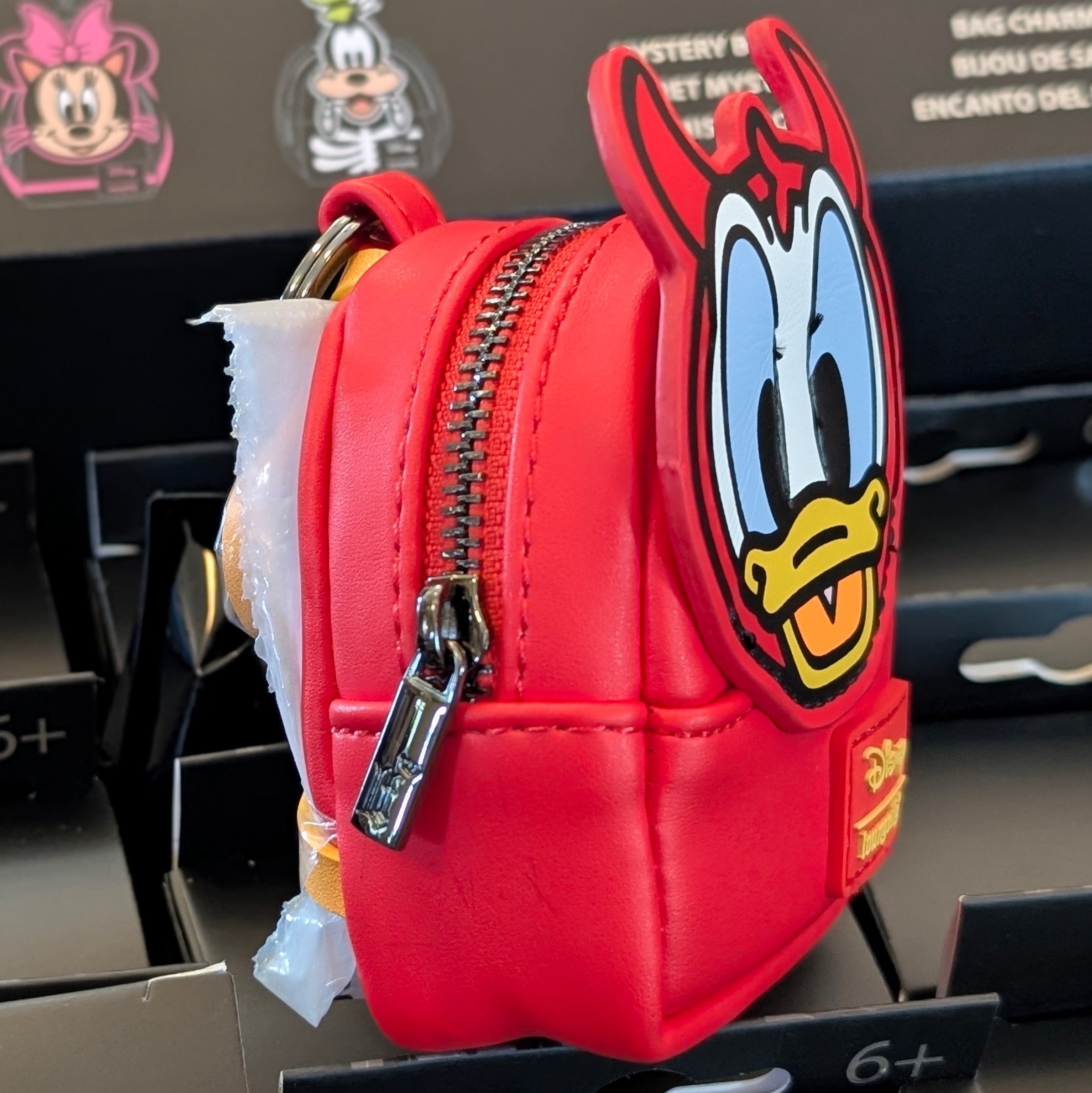 Loungefly mini backpack bag charm featuring Devil Donald Duck in red with working zipper, from Disney Halloween collection.