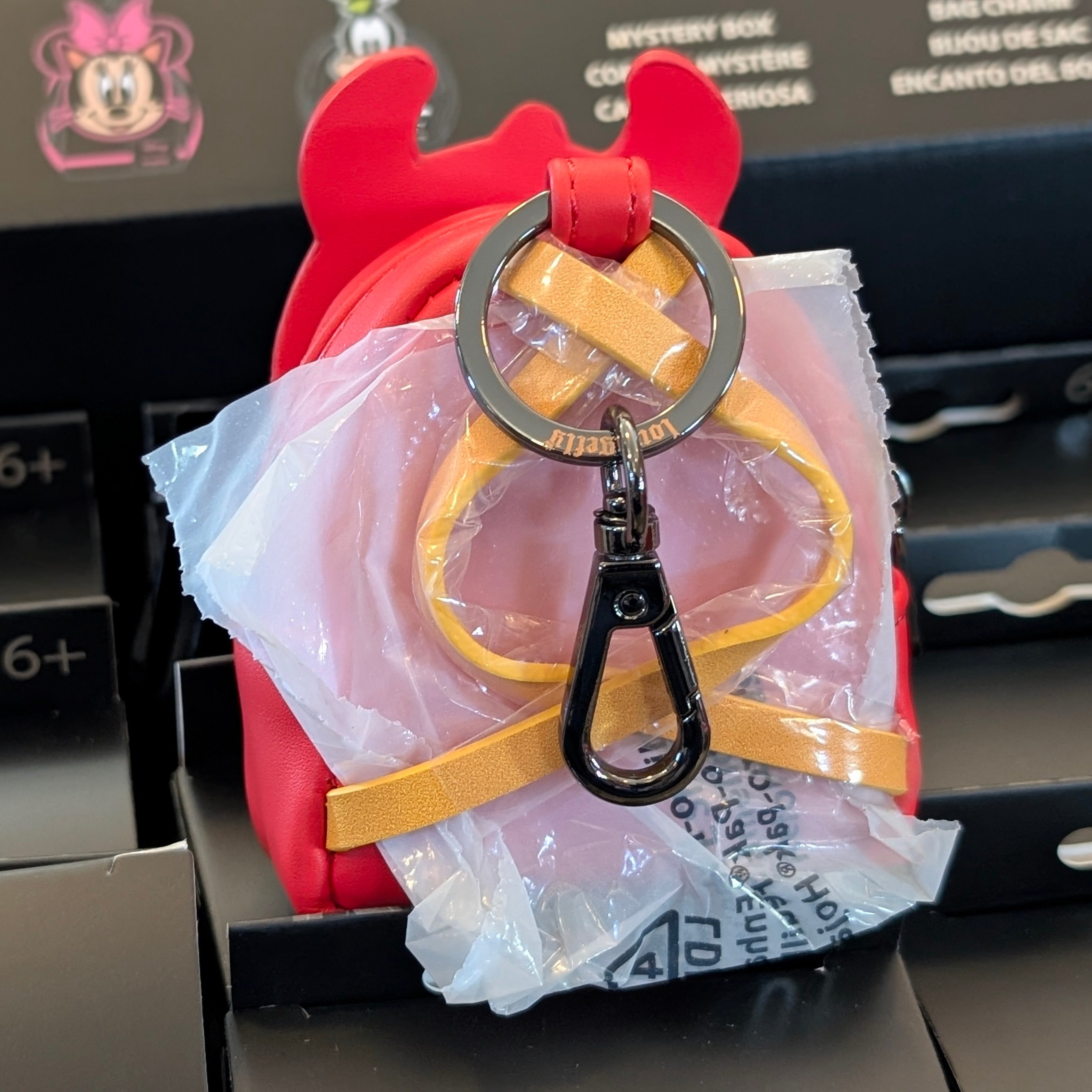 Loungefly Disney mini backpack bag charm featuring Devil Donald Duck with red horns and fiery red backpack