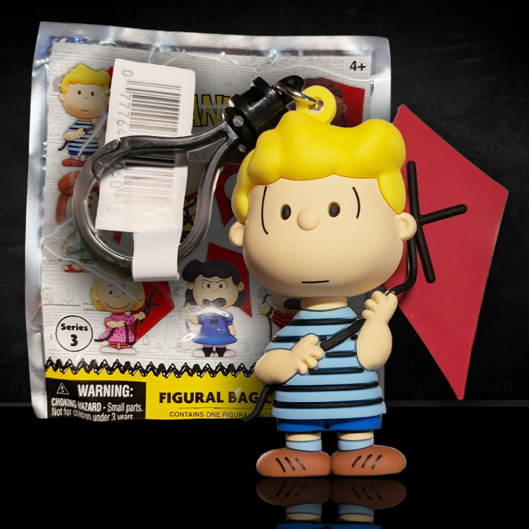 3D foam bag clip of Schroeder in blue shorts and striped shirt holding a red kite from Monogram Series 3