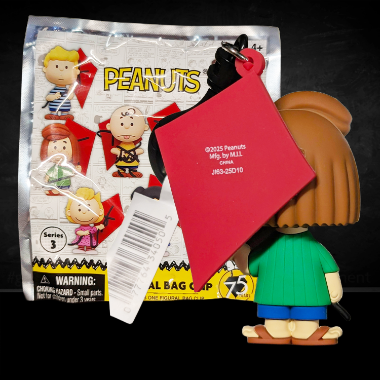 Monogram Peanuts 75th Anniversary Peppermint Patty 3D foam bag clip holding red kite with blue shorts and green shirt