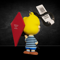 Schroeder Peanuts 75th Anniversary 3D foam bag clip by Monogram holding a red kite with blue striped shirt and shorts