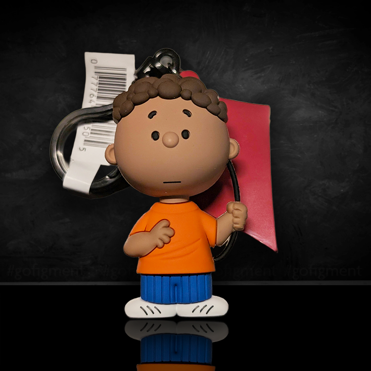 Franklin Peanuts 75th Anniversary Monogram 3D foam bag clip figure holding red kite on black background