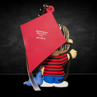 Linus bag clip from Peanuts 75th Anniversary by Monogram holding blue blanket and red kite viewed from back