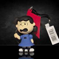 3D foam bag clip of Lucy van Pelt wearing a blue dress holding a red kite by Monogram, from Peanuts 75th Anniversary series.