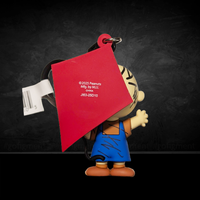 3D foam bag clip of Peanuts character Pig-Pen in blue overalls holding red kite by Monogram, celebrating 75th anniversary.