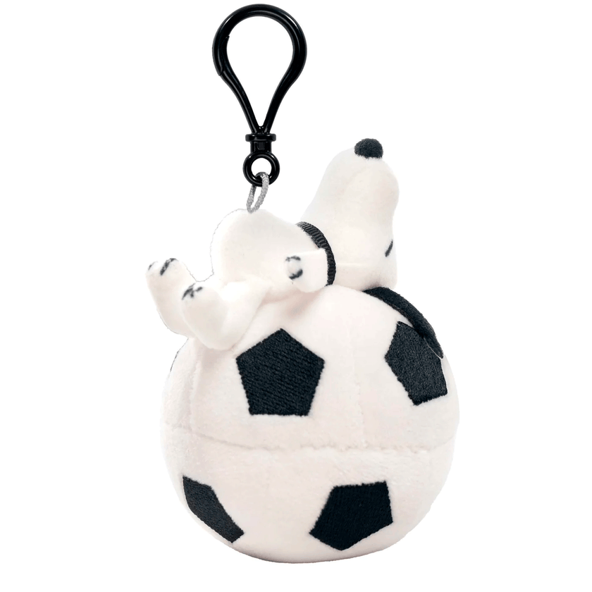 Go Figment plush Snoopy keychain lying on a soccer ball with a black clip attached above
