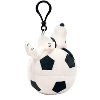 Go Figment plush Snoopy keychain lying on a soccer ball with a black clip attached above