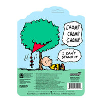 Super7 Peanuts Charlie Brown figure with Kite-Eating Tree comic panel background and kite in progress