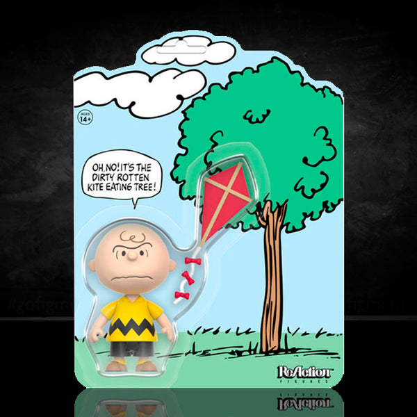 Super7 Charlie Brown and Kite Eating Tree ReAction figure with kite in comic panel packaging display.