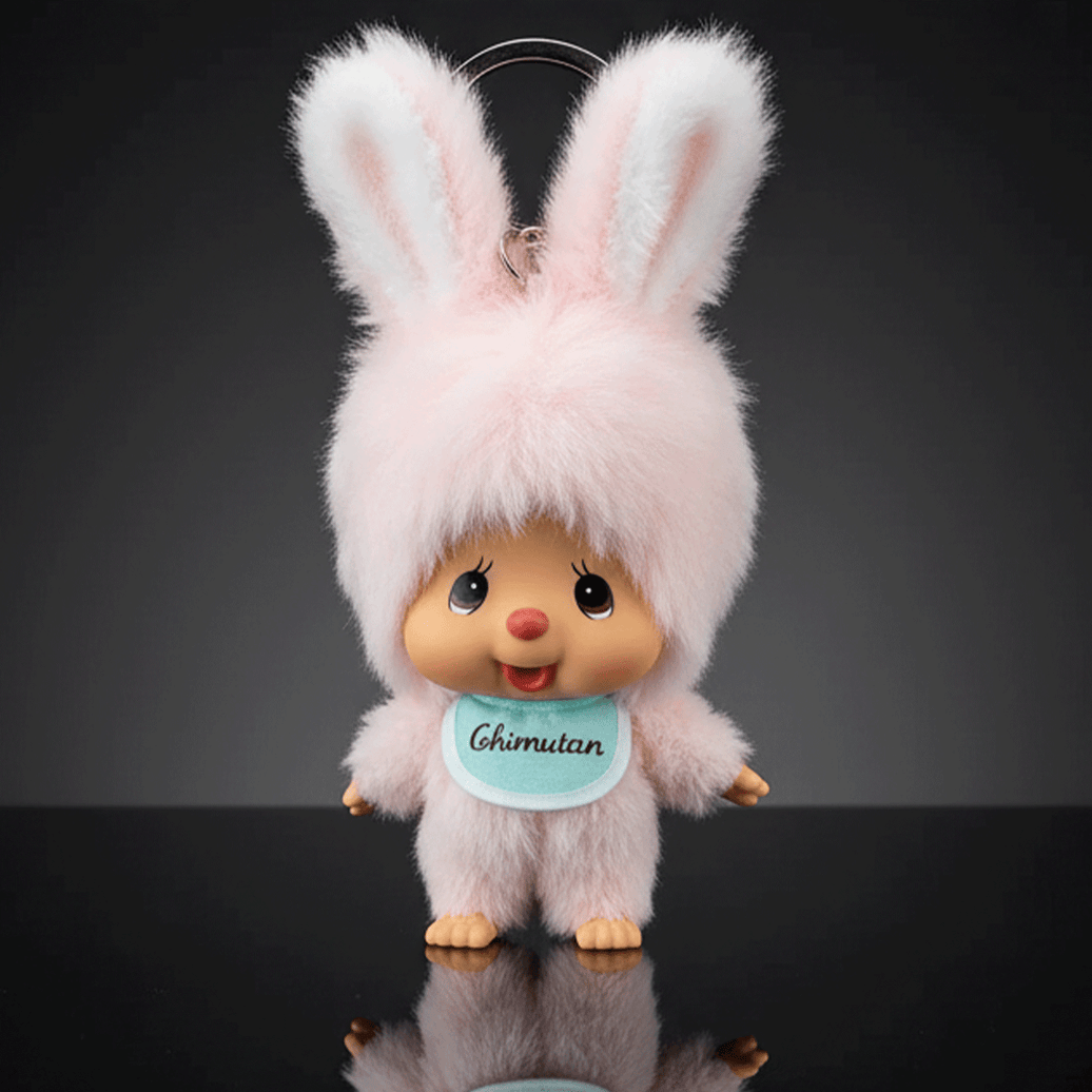 Sekiguchi 4-inch Monchhichi plush keychain dressed in fluffy pink bunny outfit with blue bib labeled Chimutan
