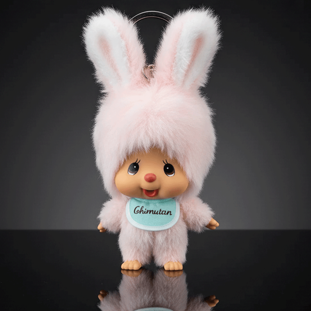Sekiguchi 4-inch Monchhichi plush keychain dressed in fluffy pink bunny outfit with blue bib labeled Chimutan