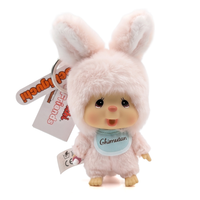 Pink bunny plush doll with long ears, rosy cheeks, and a blue bib