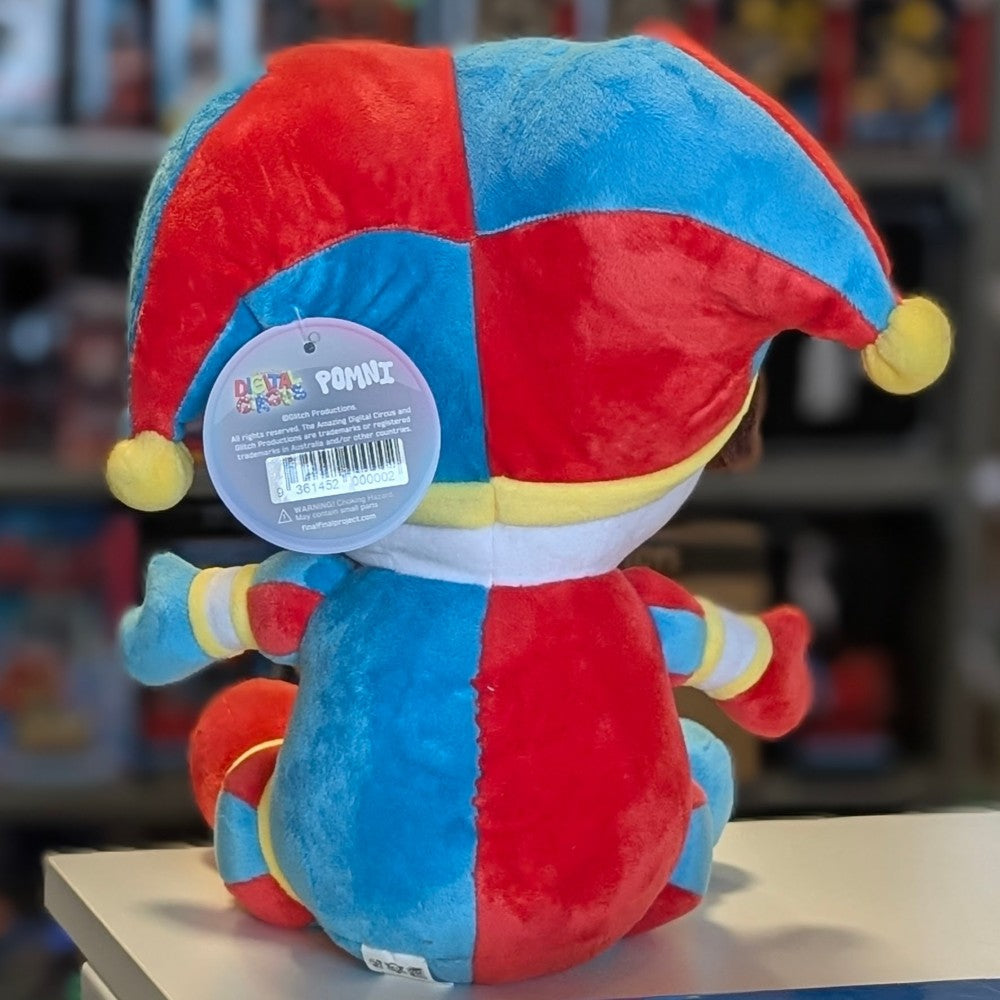 Back view of Glitch Pomni plush toy in red and blue jester outfit with tag from The Amazing Digital Circus collection