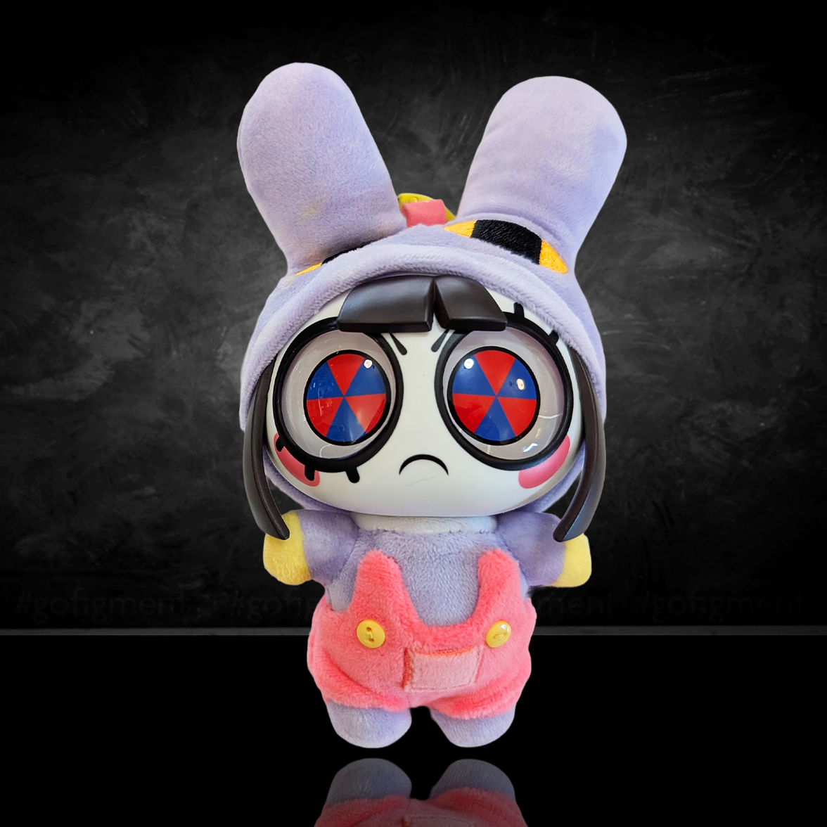 Plush toy with a unique design on a dark background
