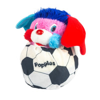 Colorful Popples character plush tucked into a black and white soccer ball
