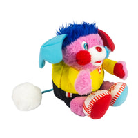 Pink and blue plush character wearing a yellow shirt, black shorts, and red and white shoes with a white pompom tail