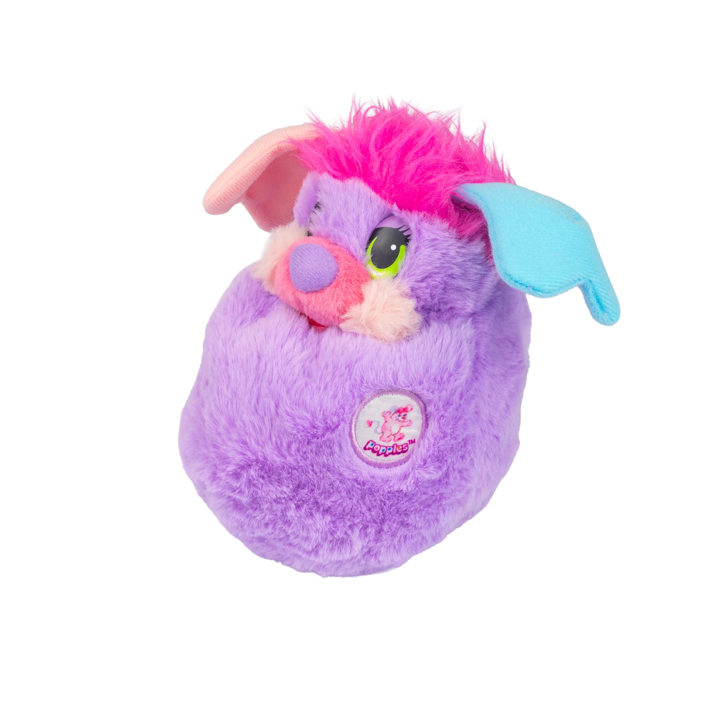 Purple plush creature with bright pink hair, colorful floppy ears, and an embroidered chest patch