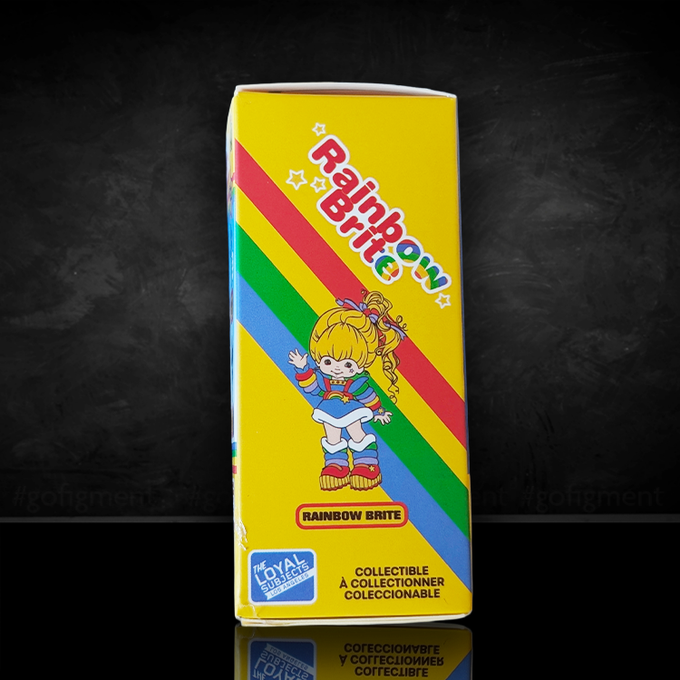 Packaging box for Loyal Subjects Rainbow Brite 2.5 inch collectible figure with colorful rainbow stripes on yellow background