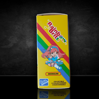 Packaging of a Rainbow Brite Moonglow figure from Loyal Subjects with colorful rainbow stripes on yellow background