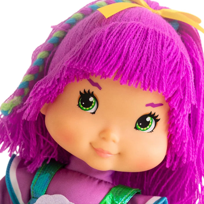 Close-up of Tickled Pink plush doll from The Loyal Subjects Rainbow Brite 5-pack collection with bright pink yarn hair and green eyes