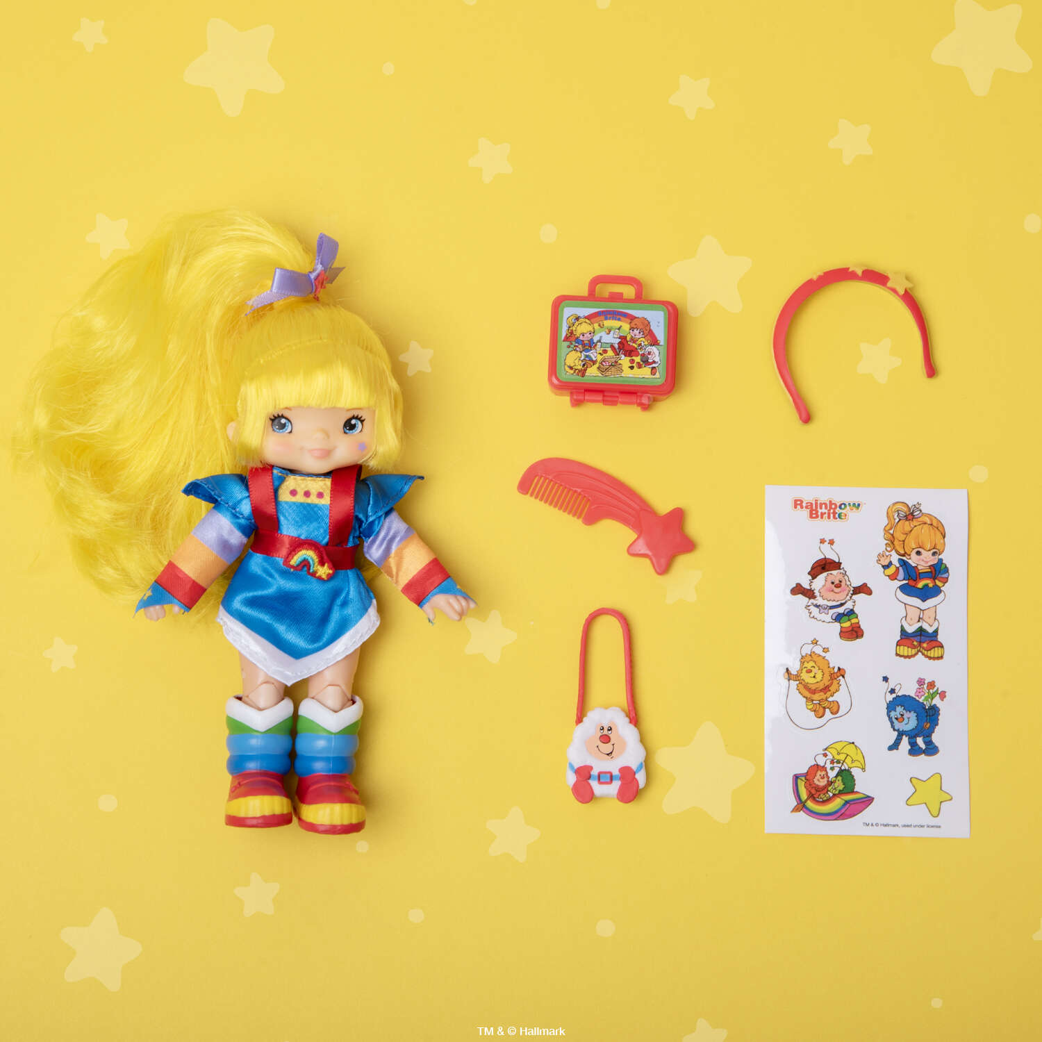 Rainbow Brite 5.5 inch fashion doll with accessories and sticker sheet by Loyal Subjects on yellow star background