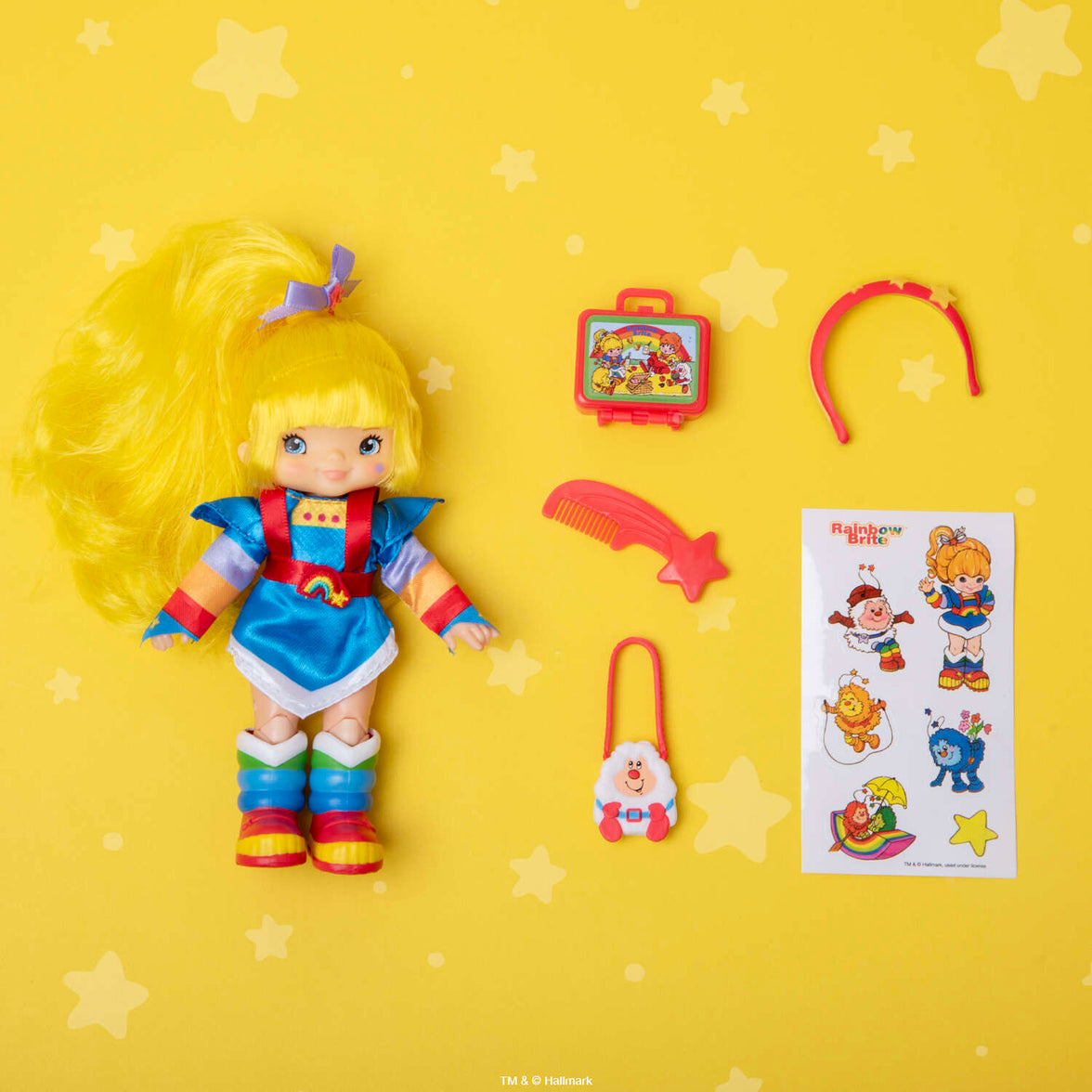 Rainbow Brite 5.5 inch fashion doll with accessories and sticker sheet by Loyal Subjects on yellow star background