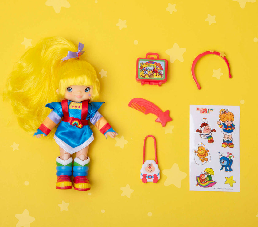 Rainbow Brite 5.5 inch fashion doll with accessories and sticker sheet by Loyal Subjects on yellow star background
