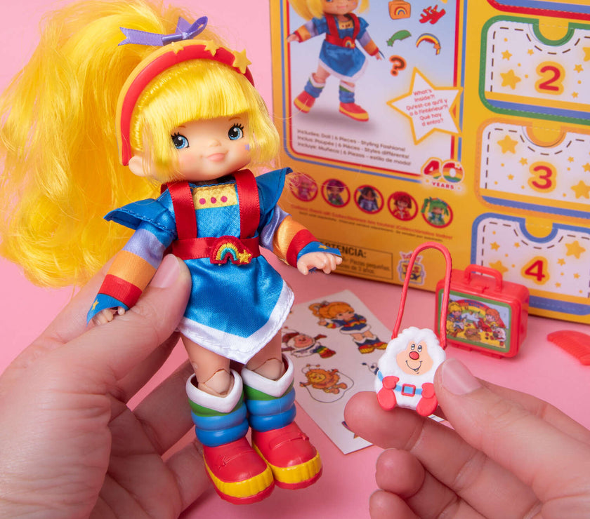 Rainbow Brite 5.5 inch fashion doll by Loyal Subjects with colorful outfit and accessories in hand held view