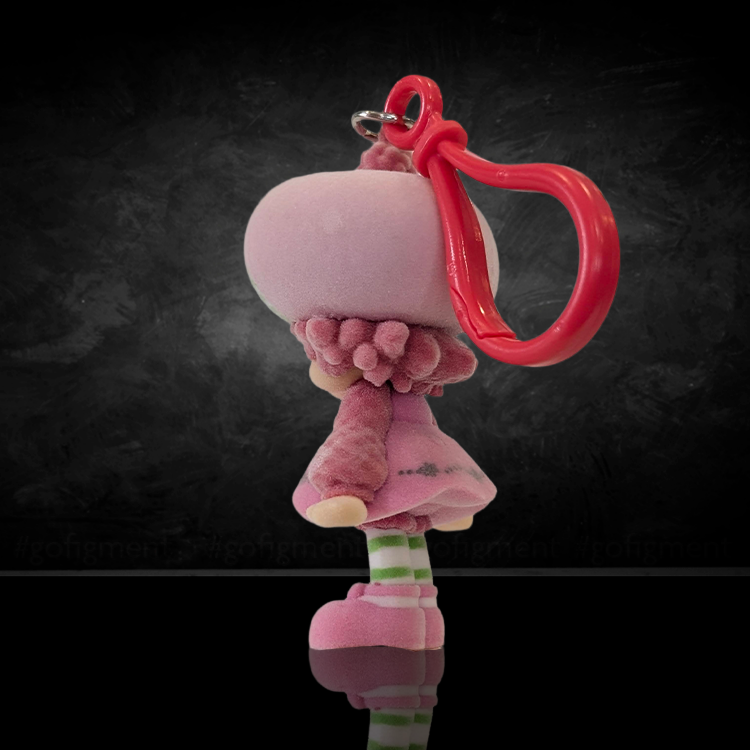 UCC World of Strawberry Shortcake soft flocked mini figure clip in pink outfit with green-striped socks and red plastic hook side view