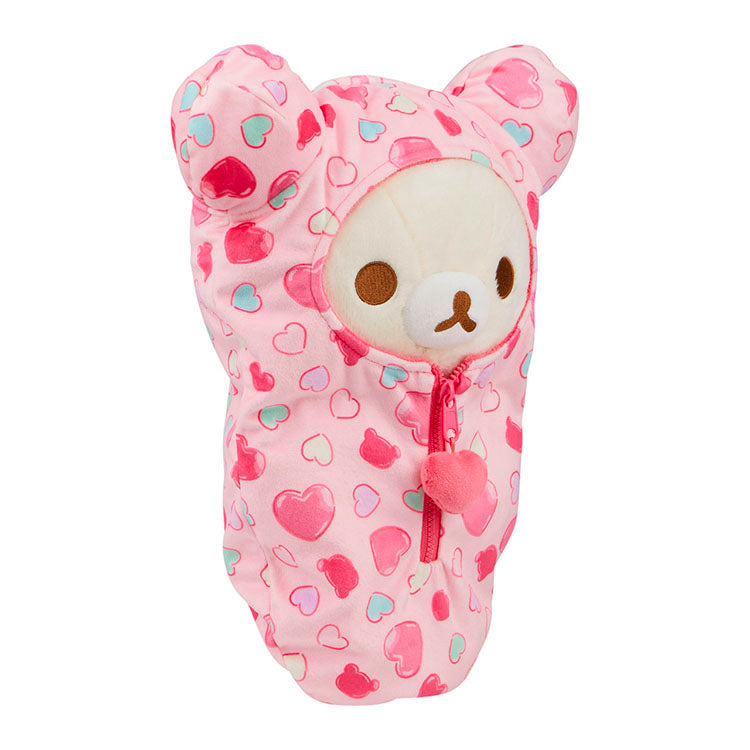Korilakkuma San-X plush sleeping bag in pink with heart pattern and zipper, featuring bear ears design.