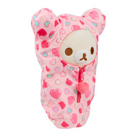 Korilakkuma San-X plush sleeping bag in pink with heart pattern and zipper, featuring bear ears design.