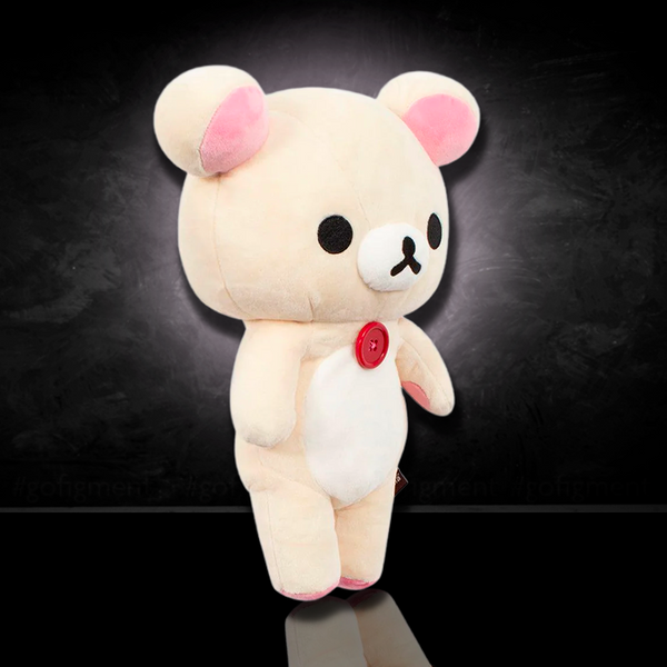 Korilakkuma plush 13.5 inch with red button from San-X classic series against dark background