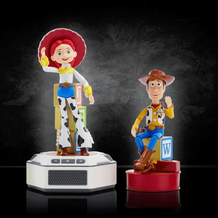 Woody and Jessie mini robot figures with bases by Robesen Robotics, posed against dark background on reflective surface