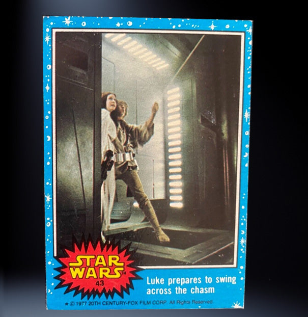 Image of #43 Luke prepares to swing across the chasm 1977 Topps Star Wars Trading Card