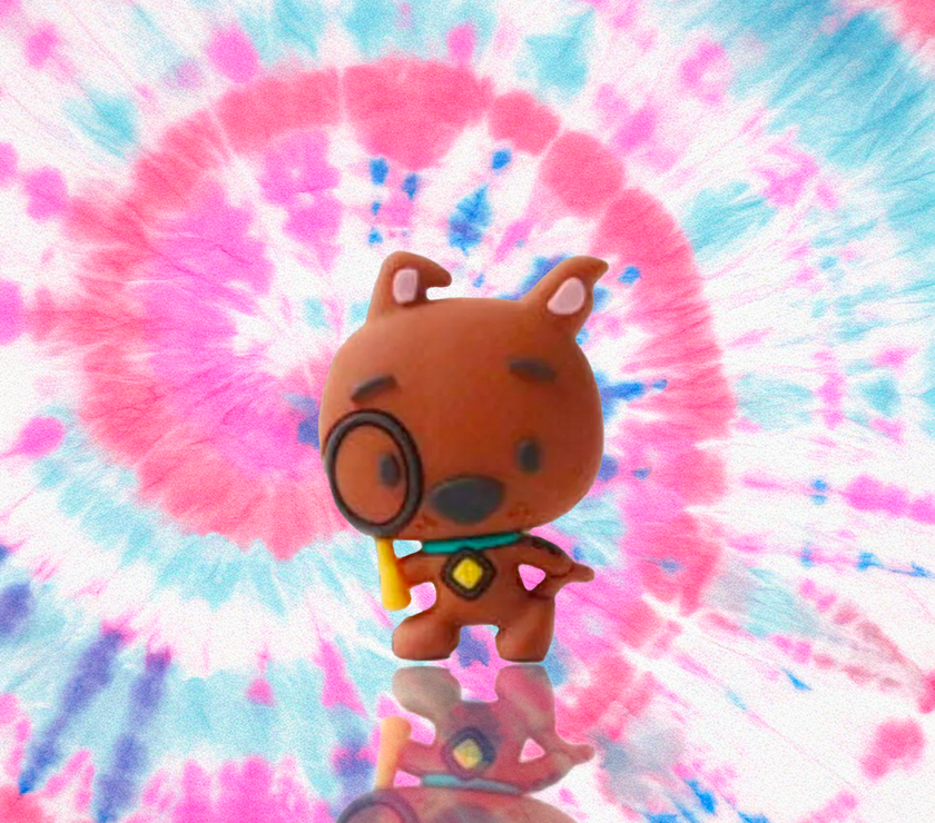 Scooby-Doo 3D mini figure holding magnifying glass on colorful tie-dye background by UCC