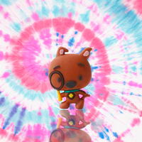 Scooby-Doo 3D mini figure holding magnifying glass on colorful tie-dye background by UCC