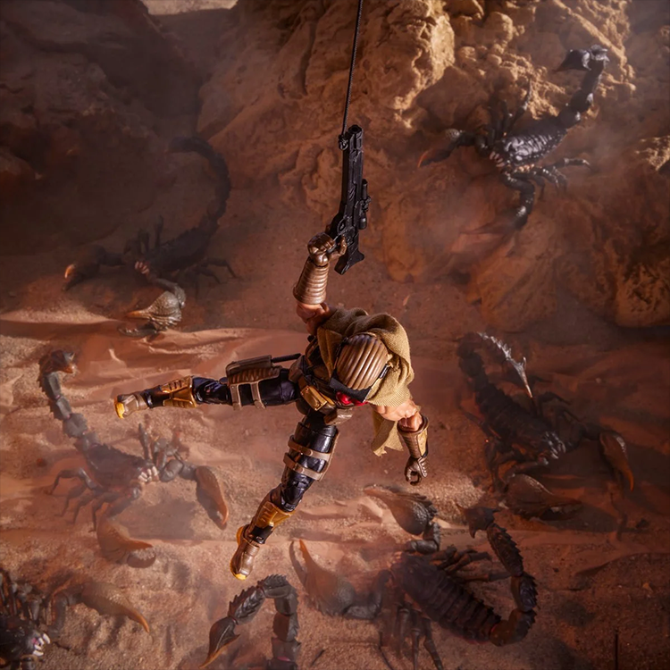 Hasbro G.I. Joe Cobra Desert Scorpion figure hanging in desert scene surrounded by mechanical scorpions