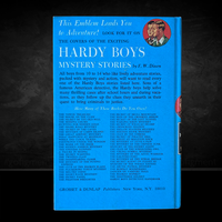 Vintage Hardy Boys blue hardcover back cover listing titles published by Grosset & Dunlap New York edition