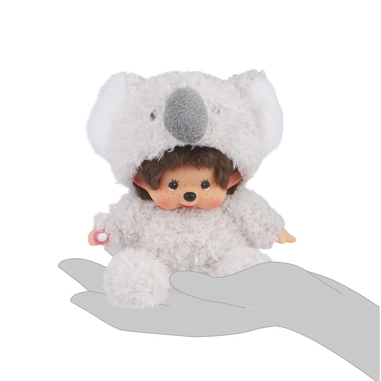 Sekiguchi Monchhichi plush doll dressed as a fluffy koala sitting on a hand, 8 inches tall, soft collectible.