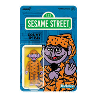 Purple Sesame Street Count character figure wearing orange pajamas with black bat prints on blue card backing with green logo panel
