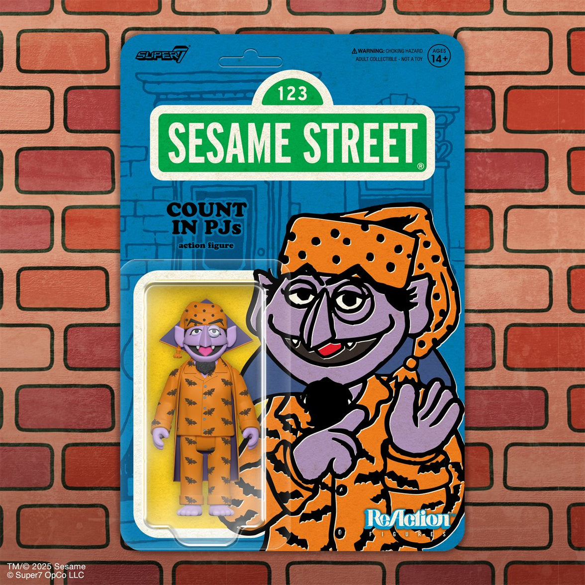 Purple vampire toy wearing orange pajamas with black bat patterns and matching nightcap on blue Sesame Street card backing.