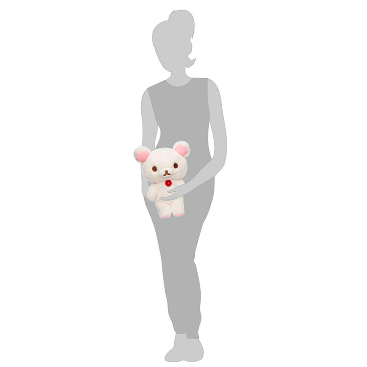 Korilakkuma 13.5 inch pink plush with iconic red button from San-X Sherbet Series held by person silhouette