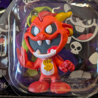 Go Figment Nightmare Critters Series 4 red devil figure with yellow horns and gold dollar sign on chest in clear packaging
