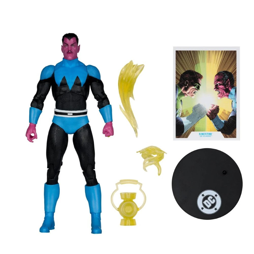 DC Comics action figure accessory set featuring a blue and black superhero figure with pink skin, yellow translucent hair extension, a comic card, a black display base with DC logo, and a lantern accessory on a white background.
